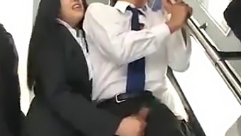 A Japanese Man Receives A Handjob On A Public Bus